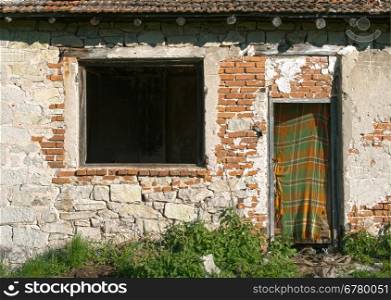 Old ruined building. Door and window of old house
