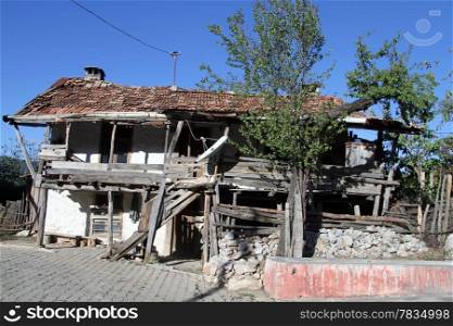 Old ruined farm house in turkish village in Turkey