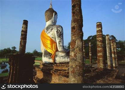 Old ruined of statue of Buddha in a temple, Wat mahathat, Sukhothai Historical Park, Sukhothai, Thailand