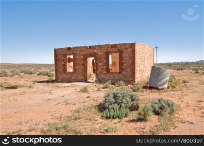 old ruins of a house in the hot australian desert. old ruins in the desert