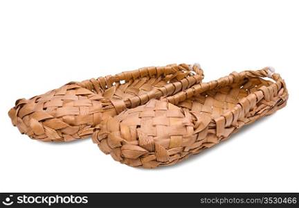 Old Russian bast shoes isolated on white background