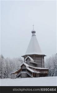 Old Russian wooden church of St. George in the northern open air museum Malye Korely near Arkhanglesk, Primorsk Region, Russia. Winter time.