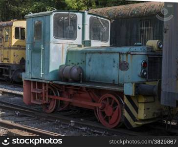 old rusted blue locomotive train at trainstation hombourg in belgium