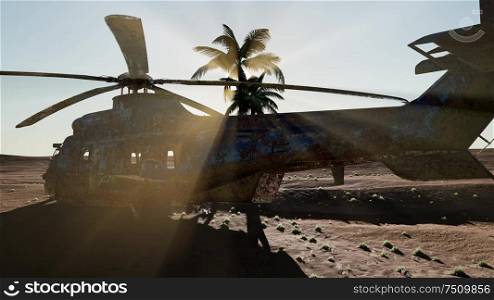 old rusted military helicopter in the desert at sunset