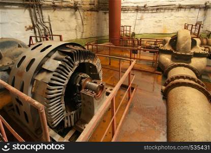 Old rusted pump station. Inside of industrial object.