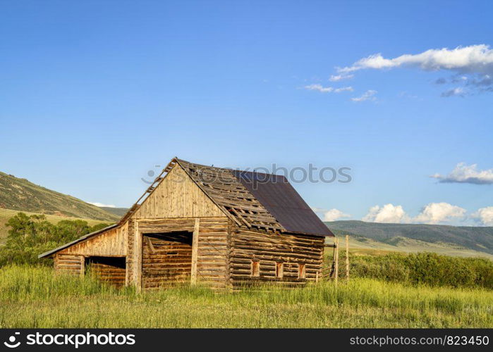 old, rustic, log barn in Colorado's Rocky Mountains