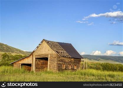 old, rustic, log barn in Colorado's Rocky Mountains