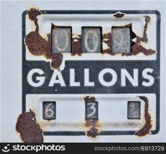 Old rusty american gas pump panel, displaying the price in dollars and filling amount in gallons