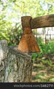 old rusty ax and stump