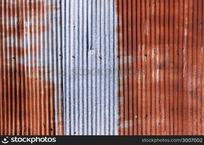 old rusty galvanized. wheathered rust and scratched steel texture corrugated iron siding vintage background