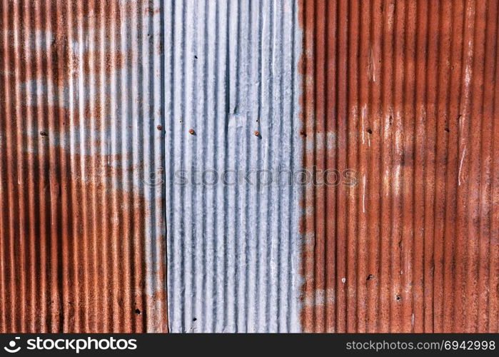 old rusty galvanized. wheathered rust and scratched steel texture corrugated iron siding vintage background