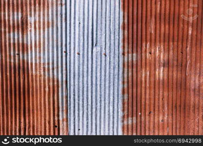 old rusty galvanized. wheathered rust and scratched steel texture corrugated iron siding vintage background