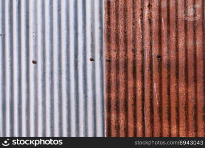 old rusty galvanized. wheathered rust and scratched steel texture corrugated iron siding vintage background