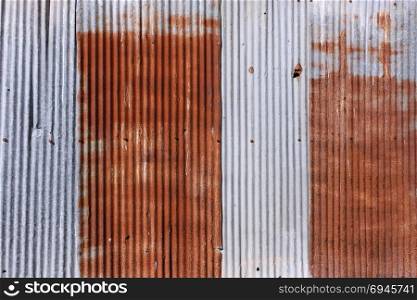 old rusty galvanized. wheathered rust and scratched steel texture corrugated iron siding vintage background