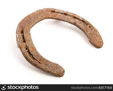 Old rusty horseshoe, isolated on a white background, selective focus