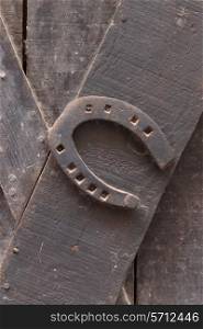 old rusty horseshoe on a door