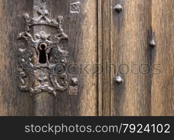 Old Rusty Keyhole with Antique Wooden Door
