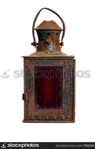 Old rusty lantern. Isolated objects: very old shabby and rusty lantern, with red glass, on white background