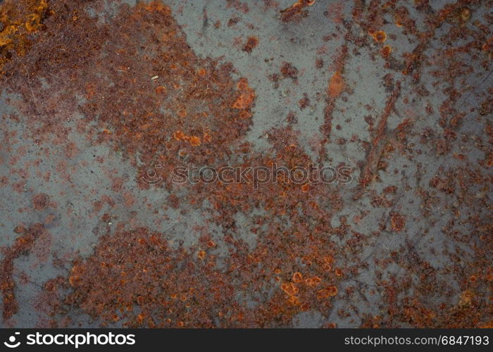 old rusty metal plate texture. Background. The texture of the old rusty metal plate with cracks