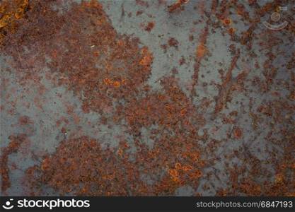 old rusty metal plate texture. Background. The texture of the old rusty metal plate with cracks