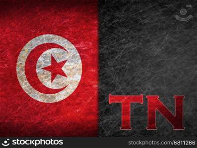 Old rusty metal sign with a flag and country abbreviation - Tunisia