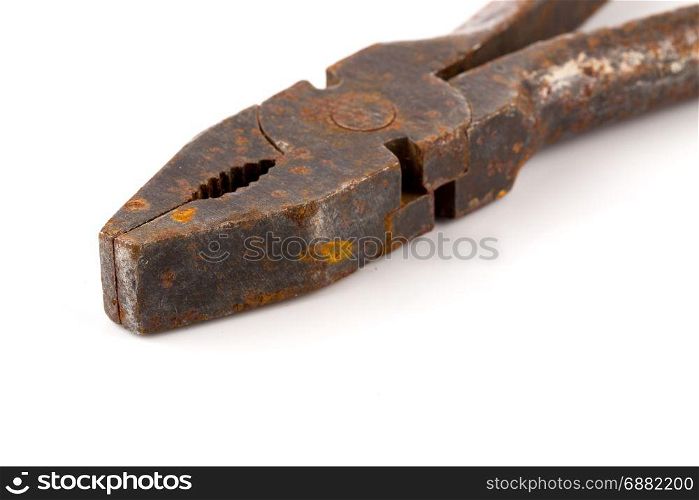 Old rusty pliers isolated on a white background