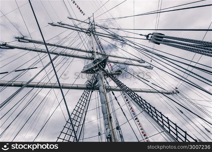 Old sailing ship mast. Tall ship rigging detail. Masts and rigging of a sailing ship