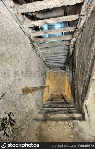 Old salt mine staircase covered with salt