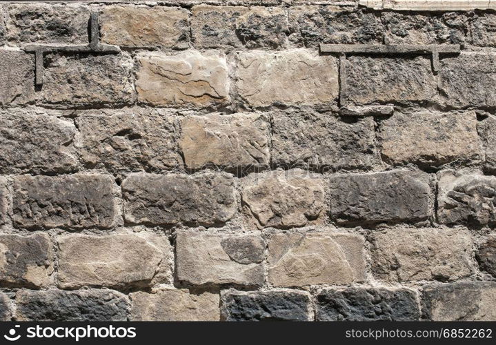 Old sand stone wall closeup as background