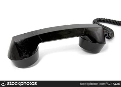 old scratched telephone receiver on white background