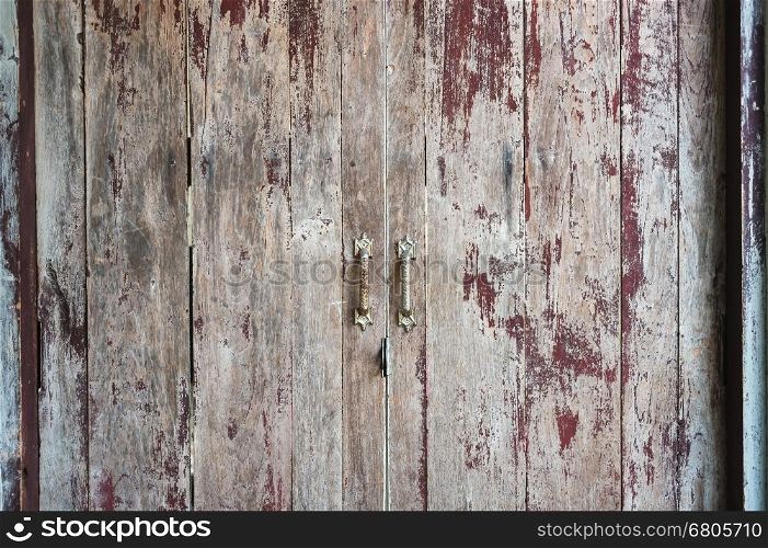 Old scratched wooden door texture background