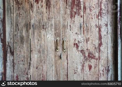 Old scratched wooden door texture background