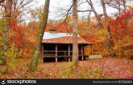 old settlers log cabin in missouri in fall