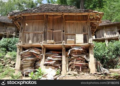 Old shed with paper waste in Yunnan, China