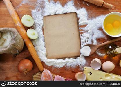 old sheet and flour on wooden background&#xA;
