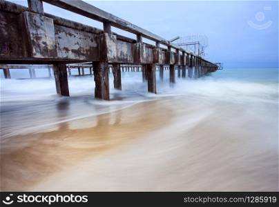 old ship pier and sea wave in storming season