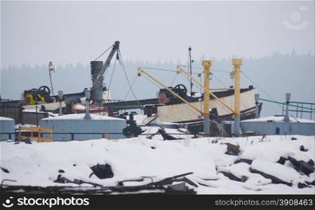 old ships on the lake in winter