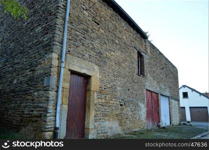 Old sizes of stone barn with garage doors