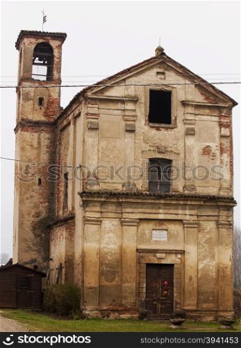 Old small church almost in ruins, vertical image