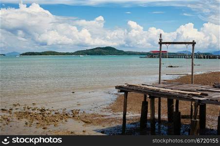 old small pier with swing on Koh Lanta Island, Krabi, Thailand