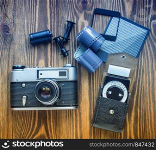 old soviet rangefinder camera,exposure meter and another trappings of film photography. old soviet rangefinder camera,exposure meter and another trappings of film photography.