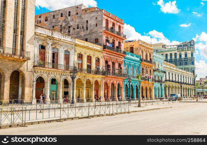 Old Spanish colonial living colorful houses across the road in the center of Havana, Cuba