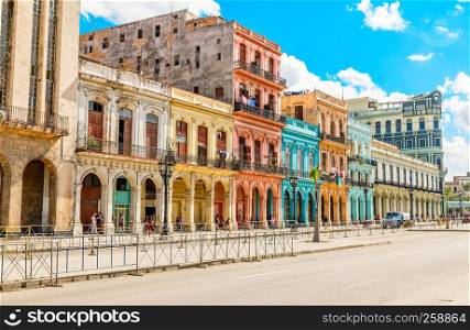 Old Spanish colonial living colorful houses across the road in the center of Havana, Cuba