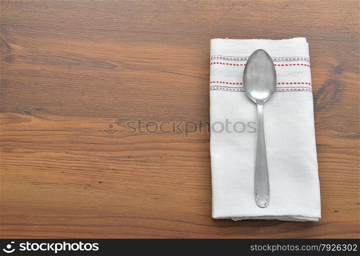 Old spoon on cloth
