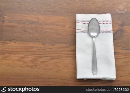 Old spoon on cloth