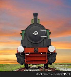 old steam engine locomotive train with beautiful twilight background
