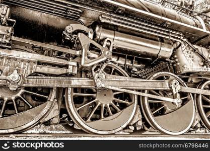 old steam locomotive wheel and rods