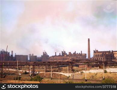Old steel factory. Smoke. Environmental pollution and global warming.