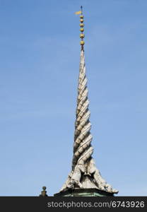 old stock exchange building in copenhagen. tower of the old stock exchange building in copenhagen, made of three dragon tails