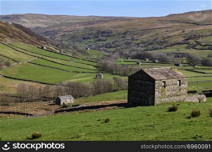 Old stone barns in Wensleydale in the Yorkshire Dales National Park in northeast England.. Wenslydale in the Yorkshire Dales National Park in northeast Eng